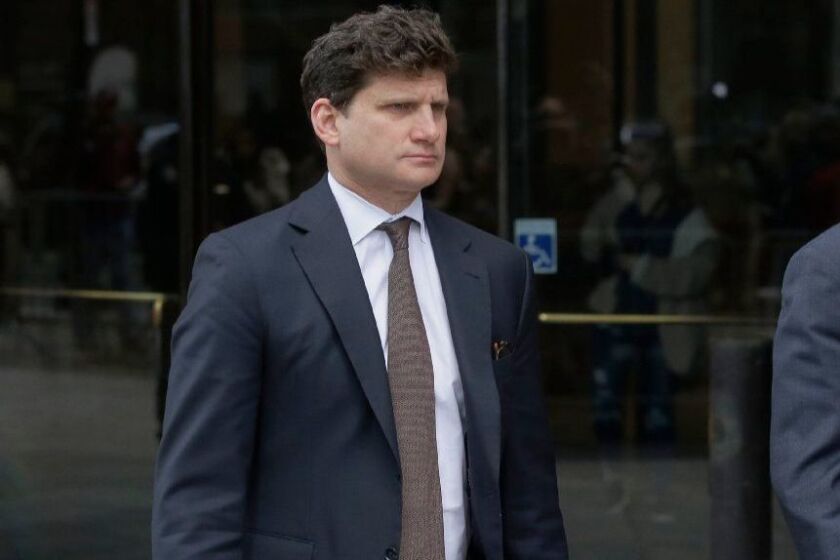 Gordon Caplan arrives at federal court in Boston on Wednesday, April 3, 2019, to face charges in a nationwide college admissions bribery scandal. (AP Photo/Steven Senne)