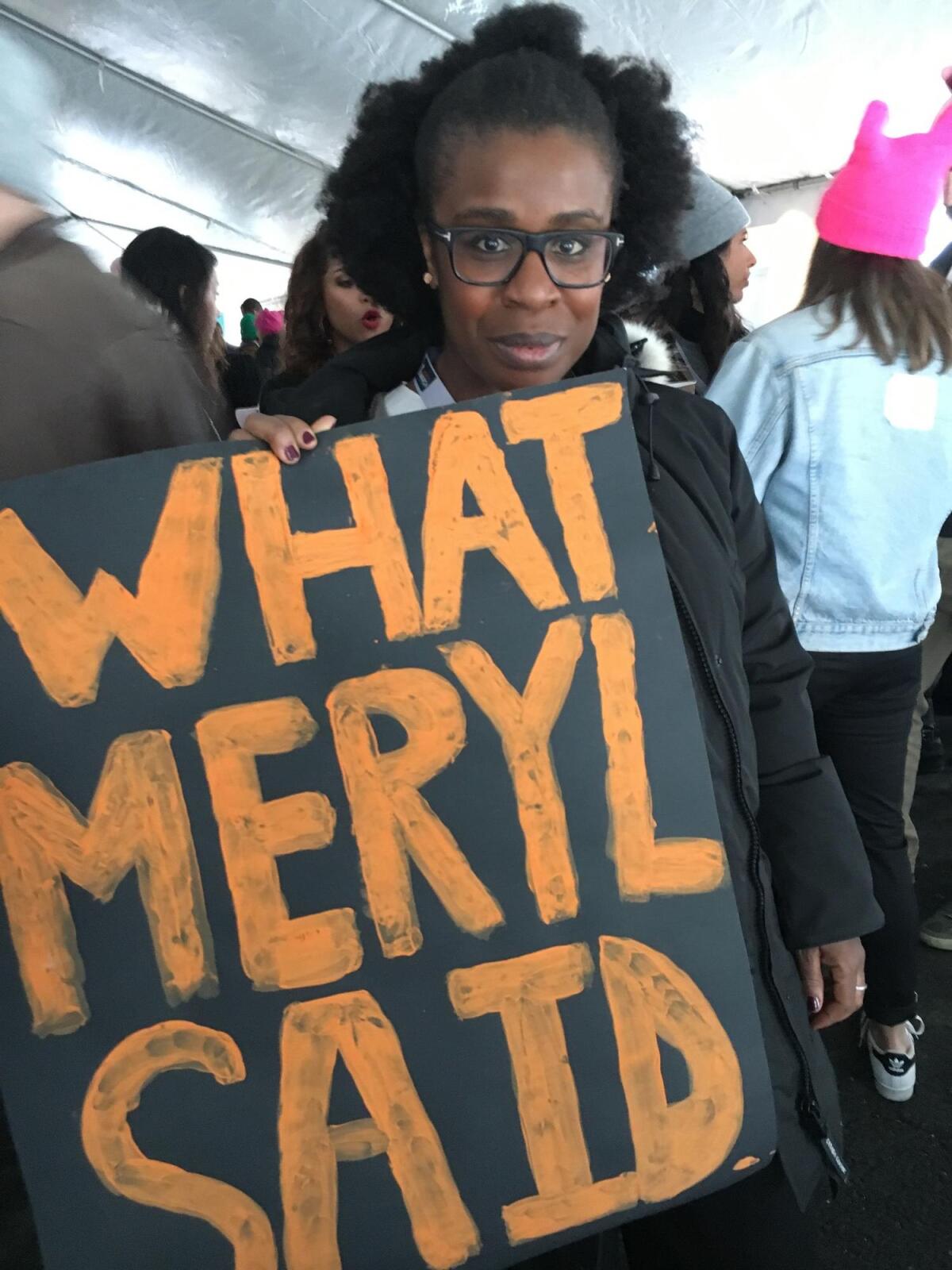 Uzo Aduba holding the "What Meryl said" sign