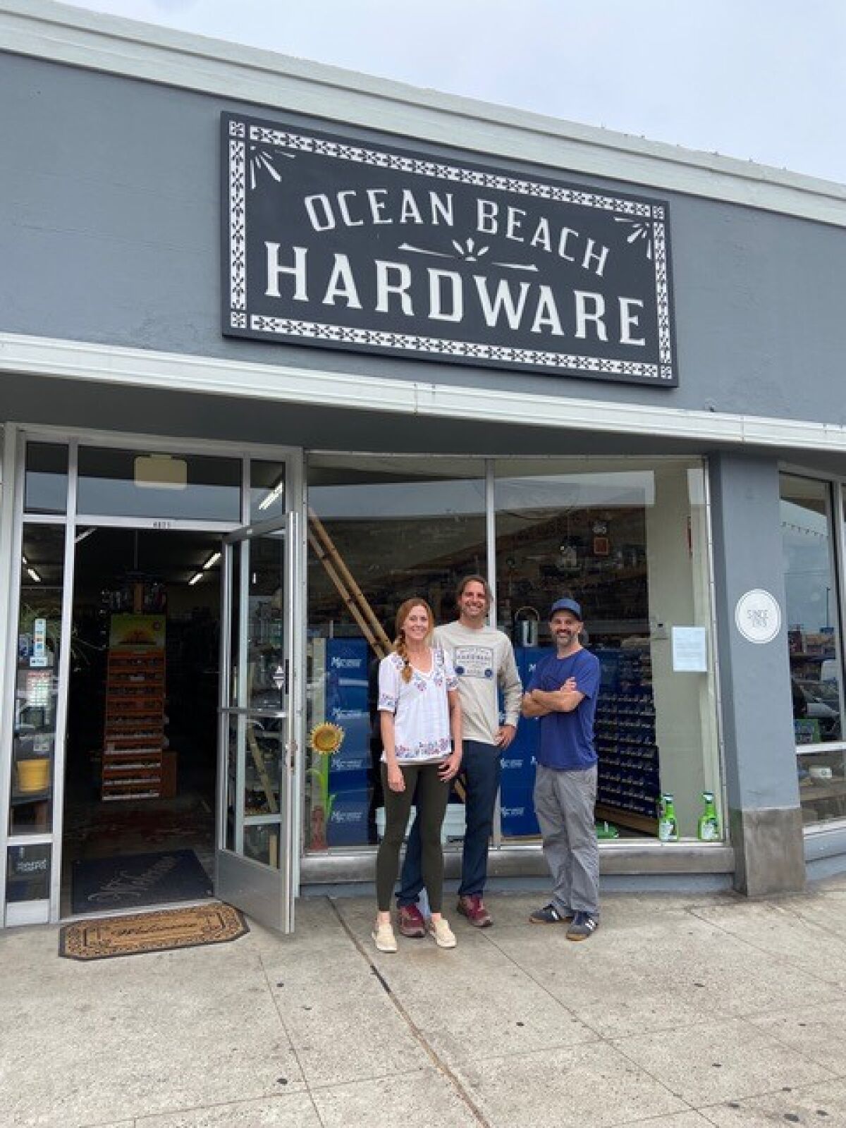 Ocean Beach residents Jenae and Joe Kuchman are the new owners of OB Hardware, taking over from Michael DeEmedio (right).