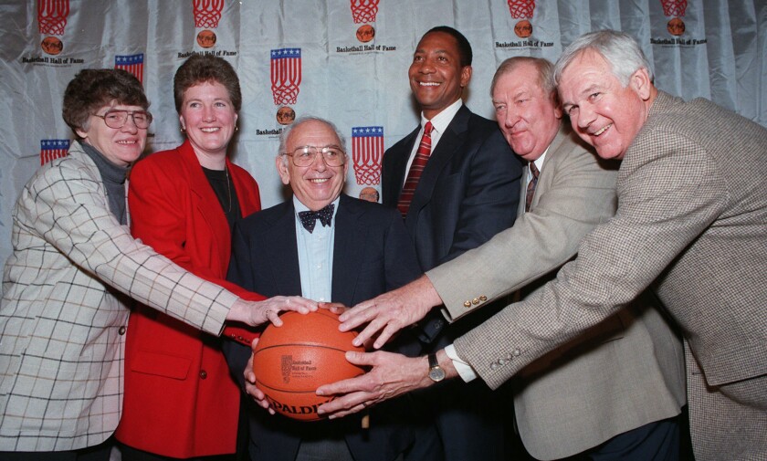 Princeton coach Pete Carril, center, poses for a photo with his fellow 1997 Naismith Basketball Hall of Fame inductees.