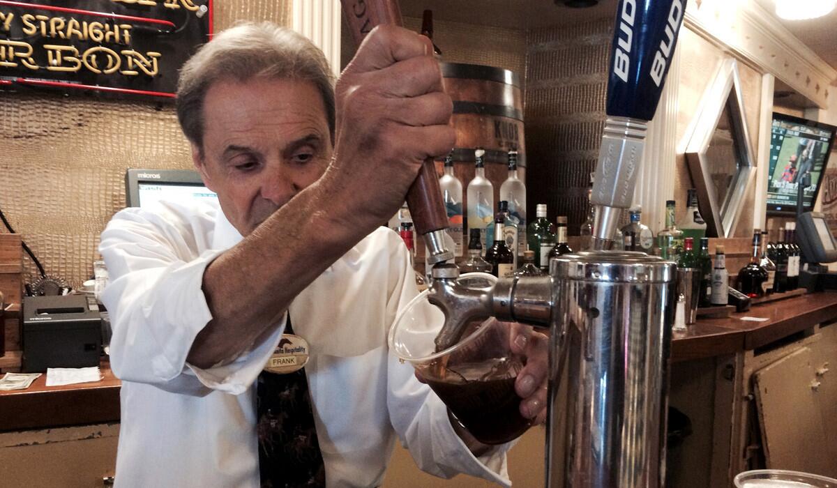 Frank Panza tends bar at Santa Anita Park, where he has worked for nearly 50 years.