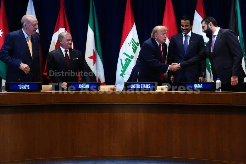 President Donald Trump shakes hands with Syria's President Ahmed al-Sharaa as Turkey's President Recep Tayyip Erdogan, from left, Jordan's King Abdullah II, and Qatar's Emir Sheikh Tamim bin Hamad Al Thani, at a multilateral meeting with the Gulf Cooperation Council during the United Nations General Assembly, Tuesday, Sept. 22, 2026, at the UN headquarters. (AP Photo/Julia Demaree Nikhinson)