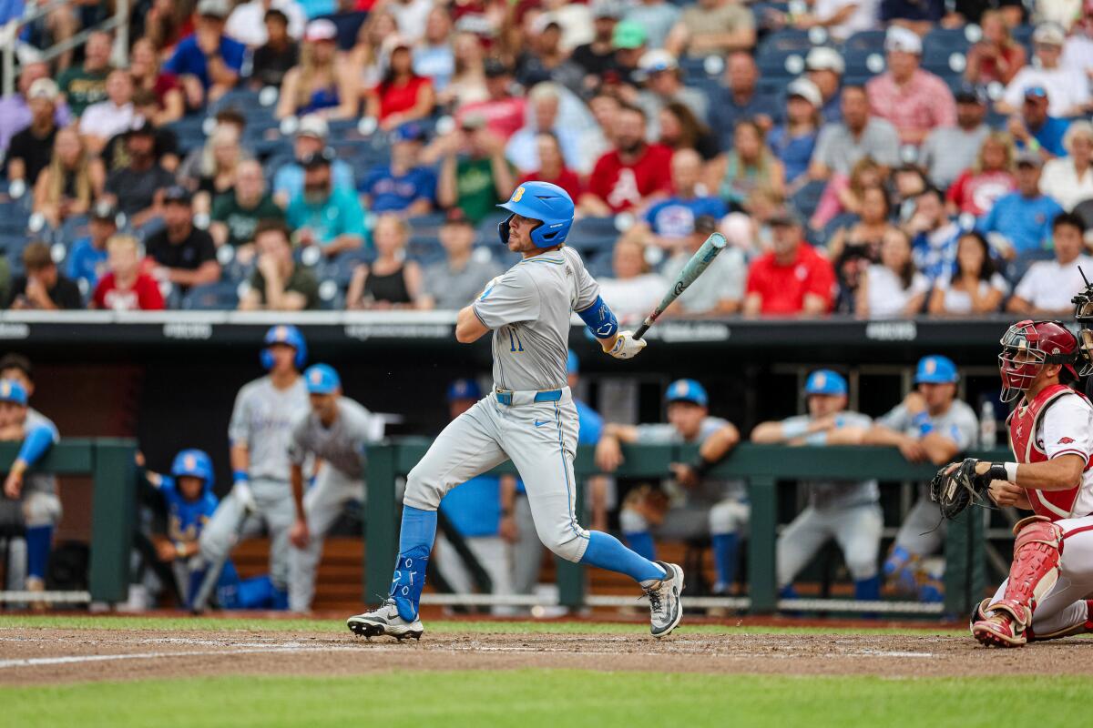 UCLA's Payton Brennan hits against Arkansas in the College World Series on Tuesday night.