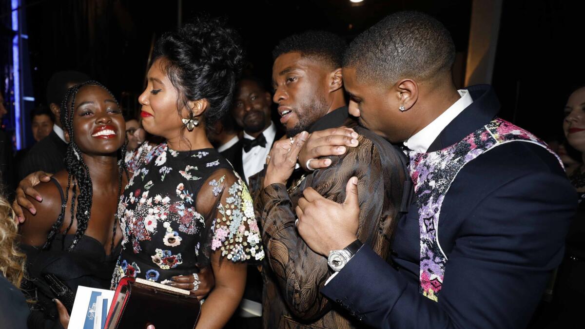 Lupita Nyong'o, left, Simone Ledward, Chadwick Boseman and Michael B. Jordan at the Screen Actors Guild Awards in 2019.