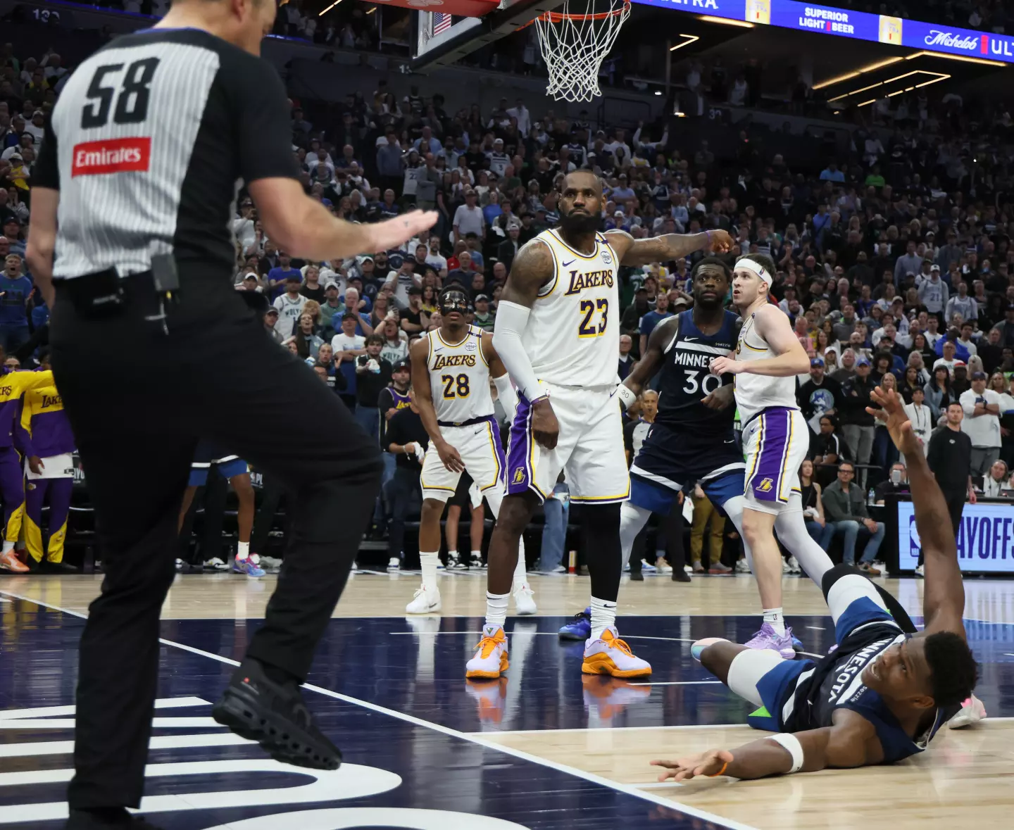 LeBron James fouls Anthony Edwards during game 4.