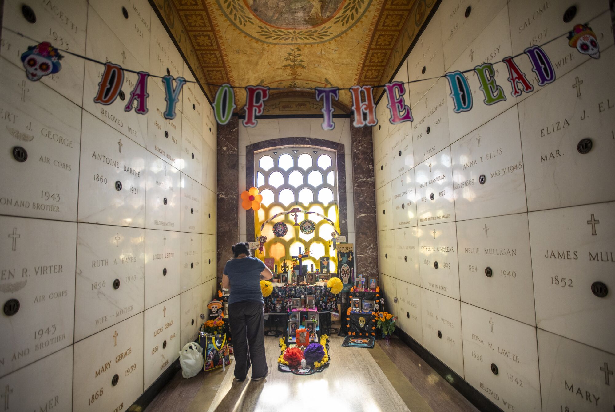 A woman inside a mausoleum.