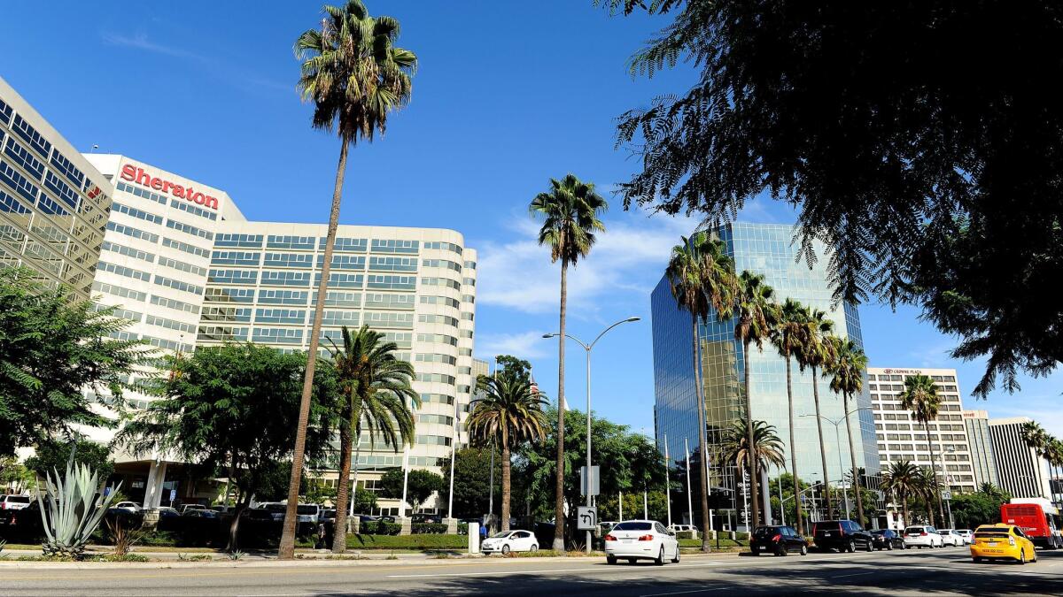 Century Boulevard near Los Angeles International Airport is crowded with hotels, most of which are owned, licensed or managed by mega-hotel companies.