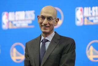 FILE - NBA Commissioner Adam Silver smiles during a news conference announcing.