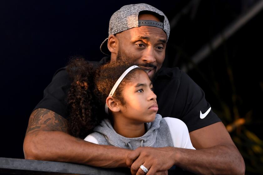 IRVINE, CA - JULY 26: Kobe Bryant and daughter Gianna Bryant watch during day 2 of the Phillips 66 National Swimming Championships at the Woollett Aquatics Center on July 26, 2018 in Irvine, California. (Photo by Harry How/Getty Images)