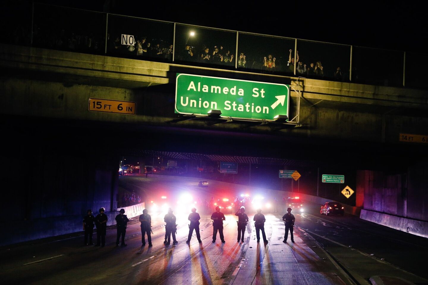 Police block traffic on the 101 Freeway near downtown L.A. as protesters rally against Donald Trump's election as president.