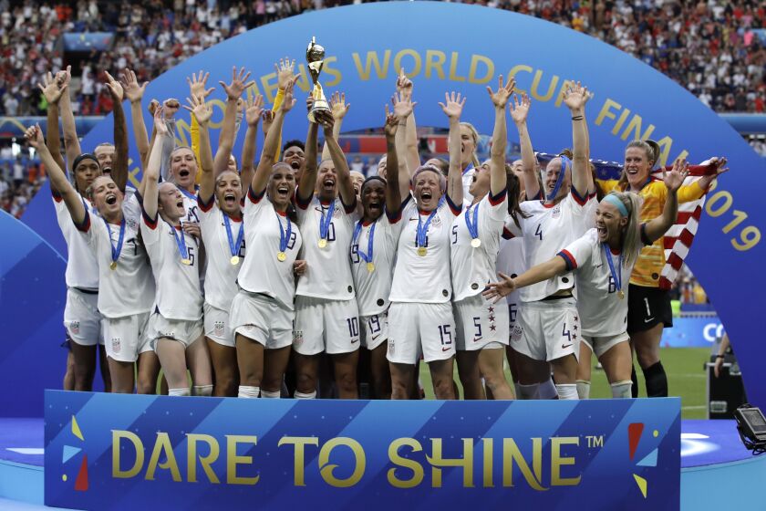FILE - Team USA celebrates after winning the Women's World Cup soccer final against the Netherlands at the Stade de Lyon in Decines, outside Lyon, France, Sunday, July 7, 2019. The United States will be playing for an unprecedented three-peat at the Women's World Cup this summer. (AP Photo/Alessandra Tarantino, File)