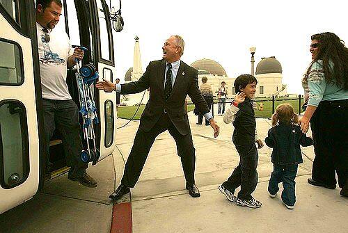 L.A. City councilman Tom LaBonge greets the first busload of visitors to the newly renovated Griffith Observatory on Friday.