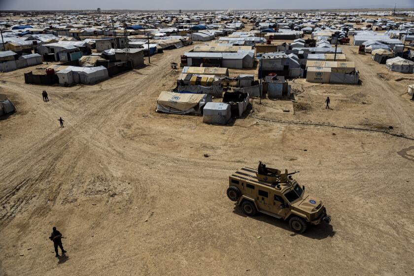 FILE - Kurdish forces patrol al-Hol camp, which houses families of members of the Islamic State group in Hasakeh province, Syria, on April 19, 2023. Iraq has repatriated hundreds more of its citizens linked to the Islamic State group from a sprawling camp in northeastern Syria, Iraqi and Syrian officials said Monday, April 29, 2024. (AP Photo/Baderkhan Ahmad, File)