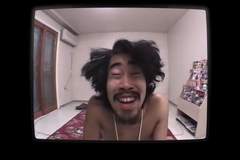 In this image provided by Hulu, Japanese comedian Nasubi appears on a hit TV reality show in Tokyo in 1998. “The Contestant” directed by Clair Titley, explores the story behind the late 1990s reality show from Japan, “A Life in Prizes,” in which a comedian nicknamed Nasubi is forced to survive on whatever he can redeem from mail-in coupons, as he is denied contact with the outside world. (Hulu via AP)