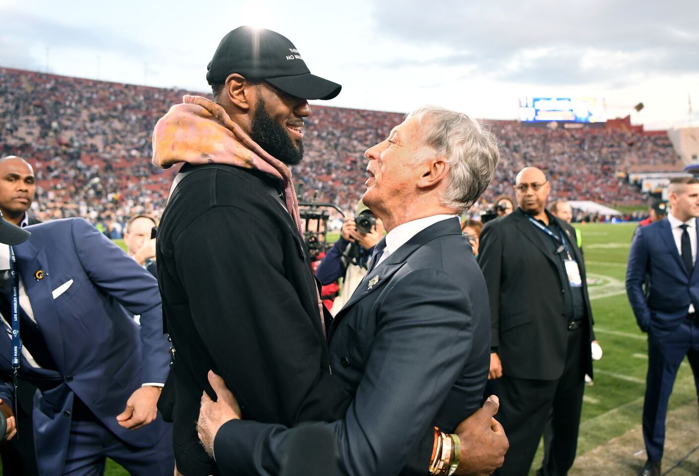Lakers star LeBron James, left, and Rams owner Stan Kroenke greet each other before the game against the Cowboys.