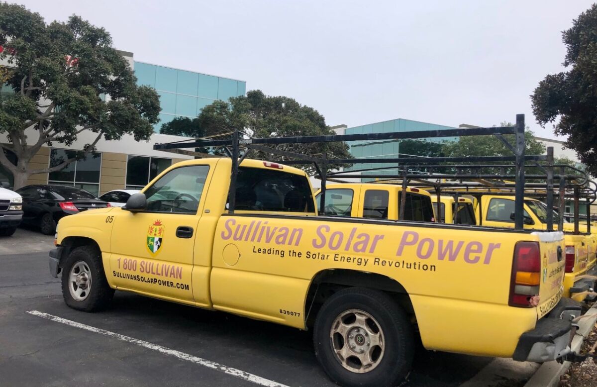 A fleet of trucks in the parking lot of Sullivan Solar Power.