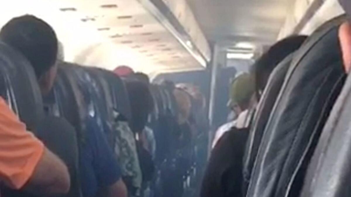 This frame from mobile phone video shows smoke inside an Allegiant Air jet after it landed at Fresno Yosemite International Airport on Monday.