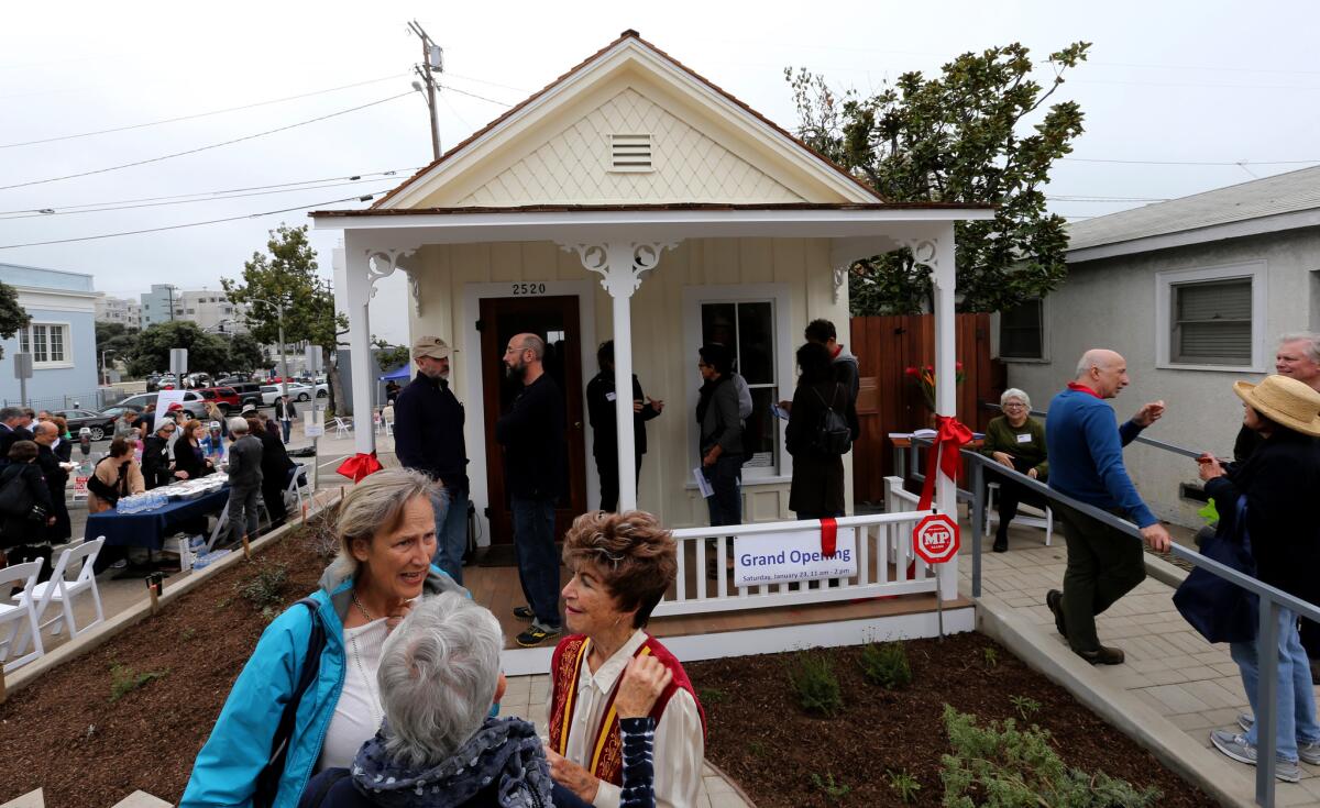Celebrants gather for the Saturday's grand opening of the Preservation Resource Center in Santa Monica, a historic shotgun house representative of domiciles in the area during the early 20th century.