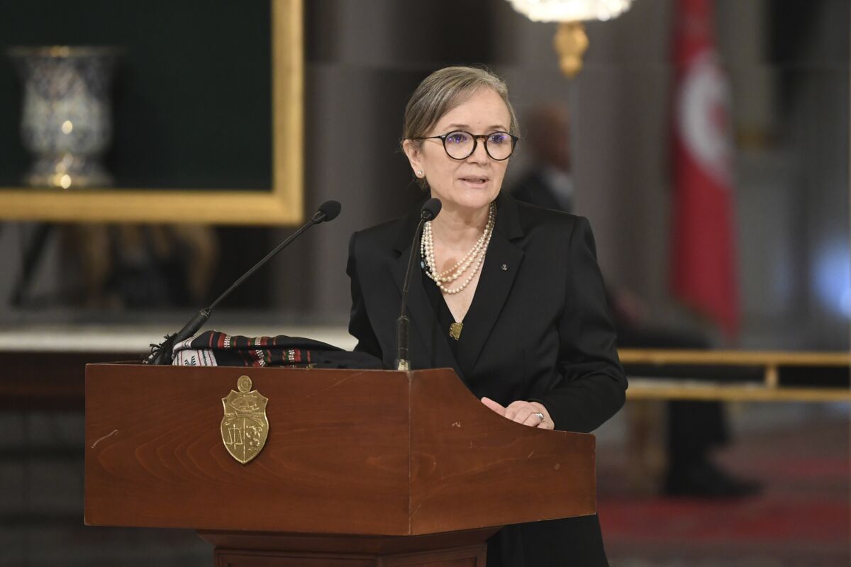 In this photo distributed by the Tunisian Presidency, Tunisian Prime Minister Najla Bouden talks during the the swearing-in ceremony of the new government, Monday, Oct.11, 2021 in Tunis. Tunisia got a new government Monday after more than two months without one, with the prime minister naming her Cabinet, including a record number of women. (Slim Abid, Tunisian Presidency via AP)