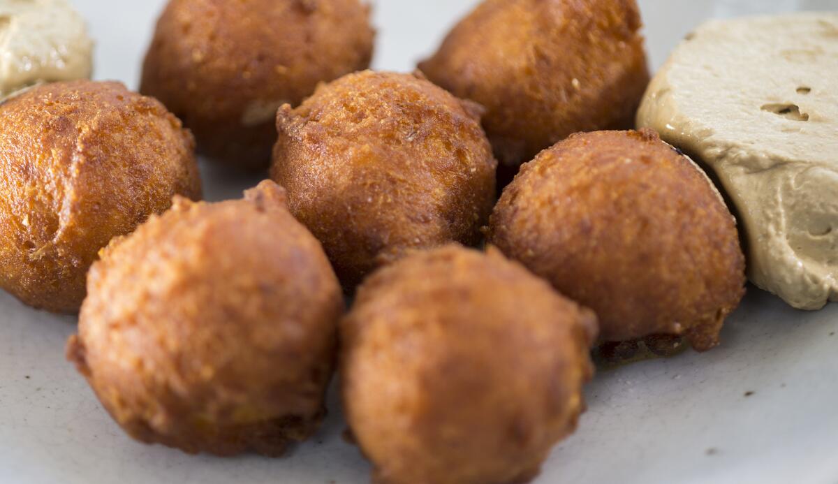 Hush puppies are served with molasses butter at Manuela, a restaurant in the middle of the Hauser & Wirth Los Angeles Arts Complex.