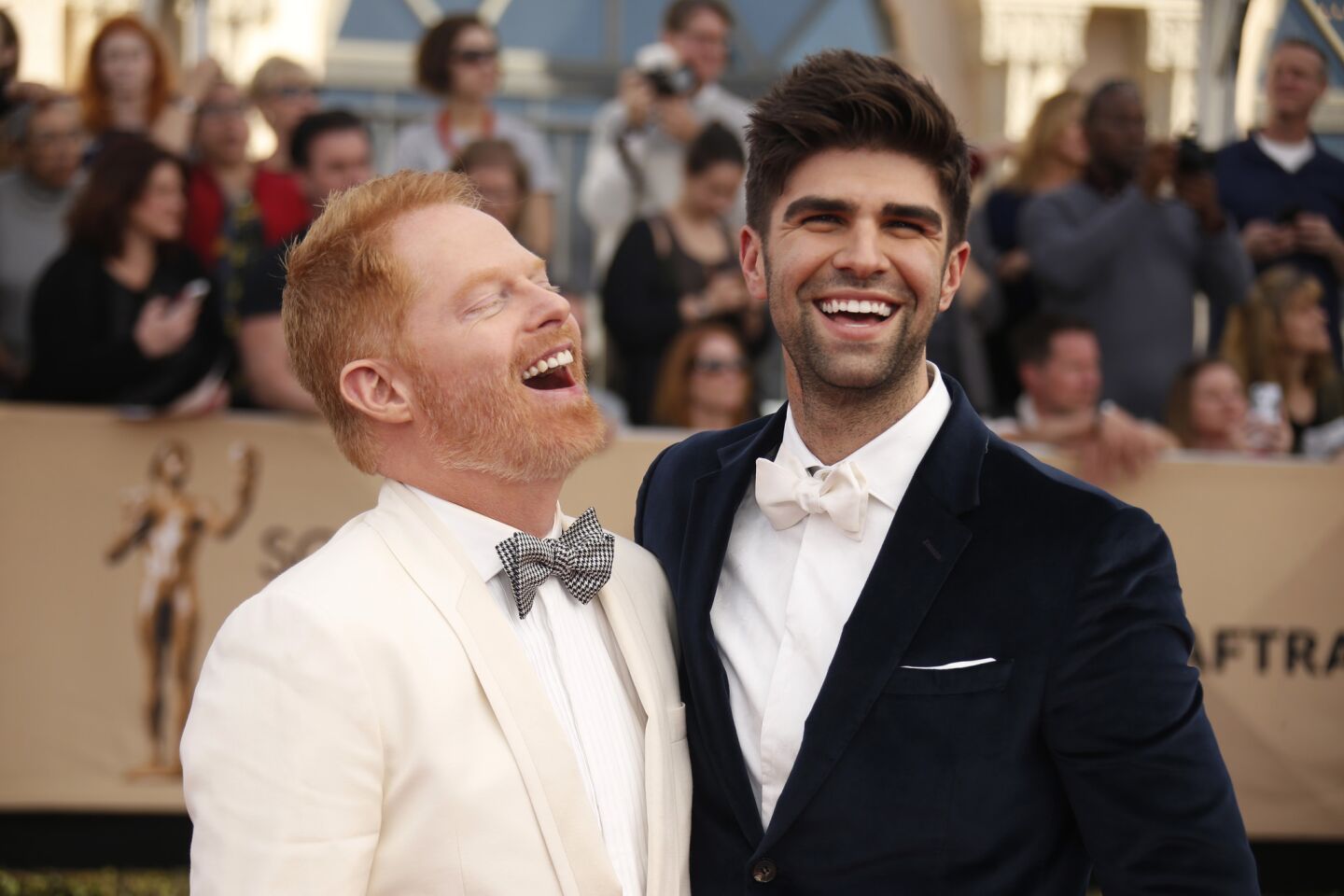 Jesse Tyler Ferguson, left, wth husband Justin Mikita, is nominated with his "Modern Family" cast mates.