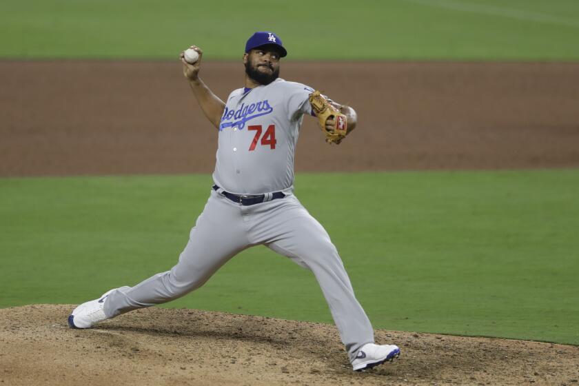 Los Angeles Dodgers relief pitcher Kenley Jansen works against a San Diego Padres batter during the ninth inning of a baseball game Tuesday, Aug. 4, 2020, in San Diego. (AP Photo/Gregory Bull)