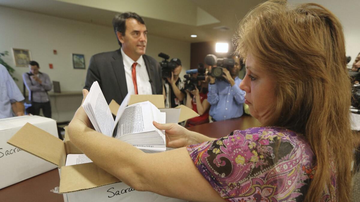 Tim Draper, seen filing petitions in Sacramento in 2014, tried to get an initiative on the ballot to split California into six states.