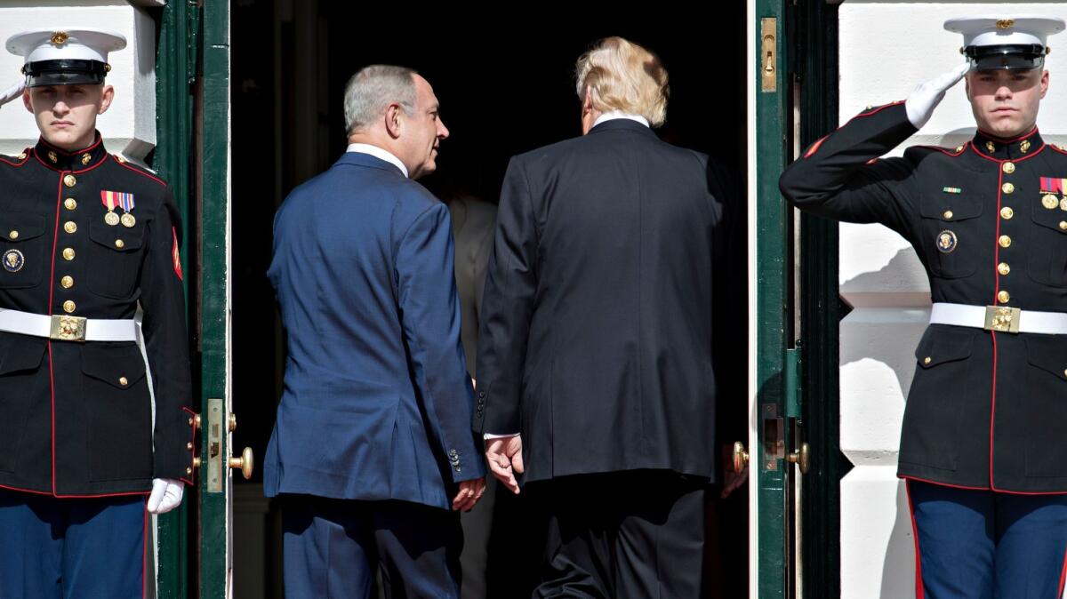 U.S. President Donald Trump and Israeli Prime Minister Benjamin Netanyahu walk into the White House on February 15, 2017 in Washington, D.C.