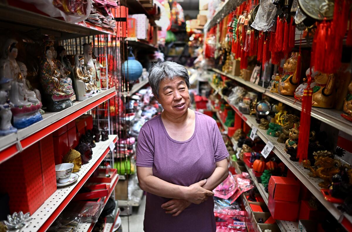 A woman stands in the middle of a gift shop
