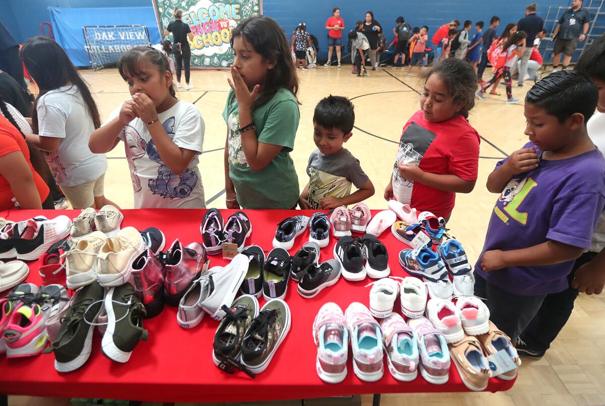 Kids from Boys & Girls Clubs of Huntington Valley get in line with anticipation.