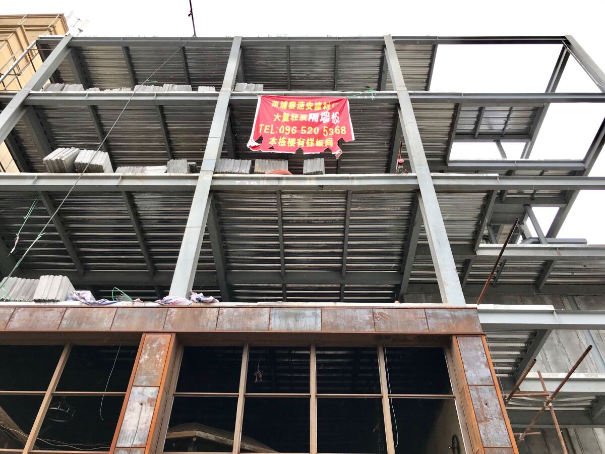 A Chinese sign hangs off a construction site in Sihanoukville, Cambodia.