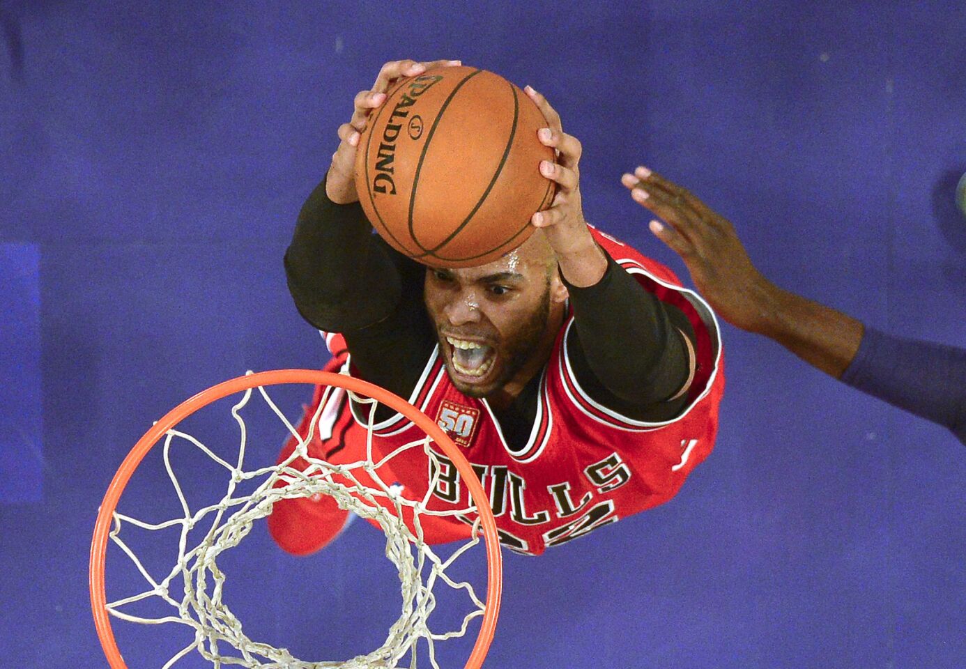Bulls forward Taj Gibson dunks during the first half against the Lakers.