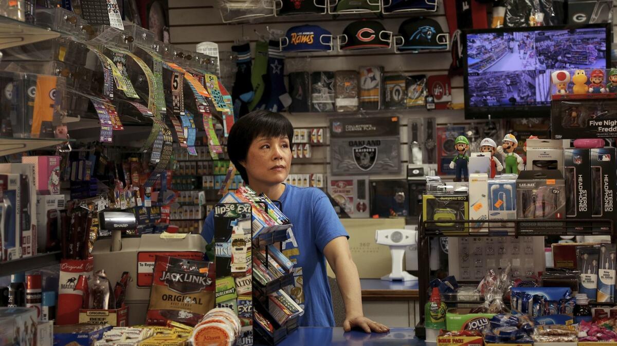 Sue Kim and her husband run a small convenience store along Cesar E. Chavez Avenue in Boyle Heights. The business has been in the family almost 40 years. (Rick Loomis / Los Angeles Times)