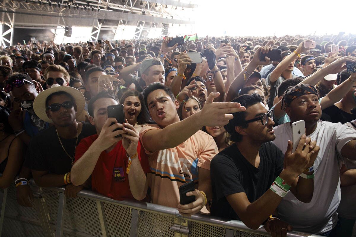 Coachella attendees gesture as grime artist and songwriter Skepta, Joseph Junior Adenuga, performs during weekend one of the three-day Coachella Valley Music and Arts Festival at the Empire Polo Grounds on Sunday, April 16, 2017 in Indio, Calif. (Patrick T. Fallon/ For The Los Angeles Times)