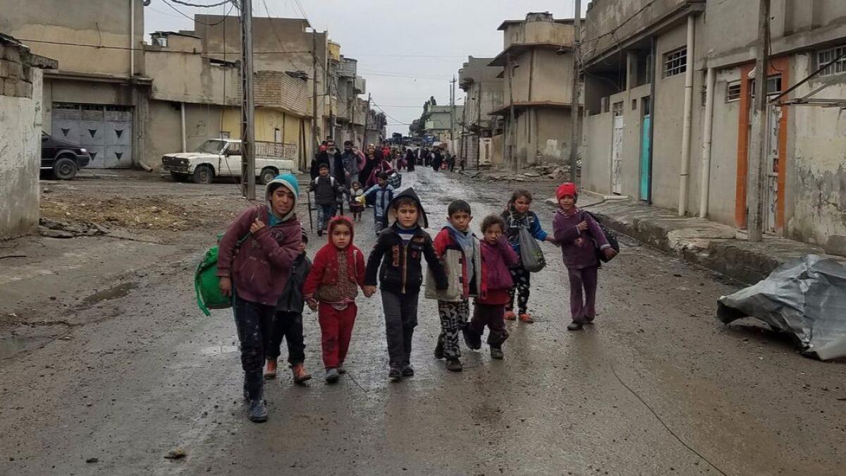 Children are among those fleeing fighting between Iraqi forces and Islamic State in Mosul.