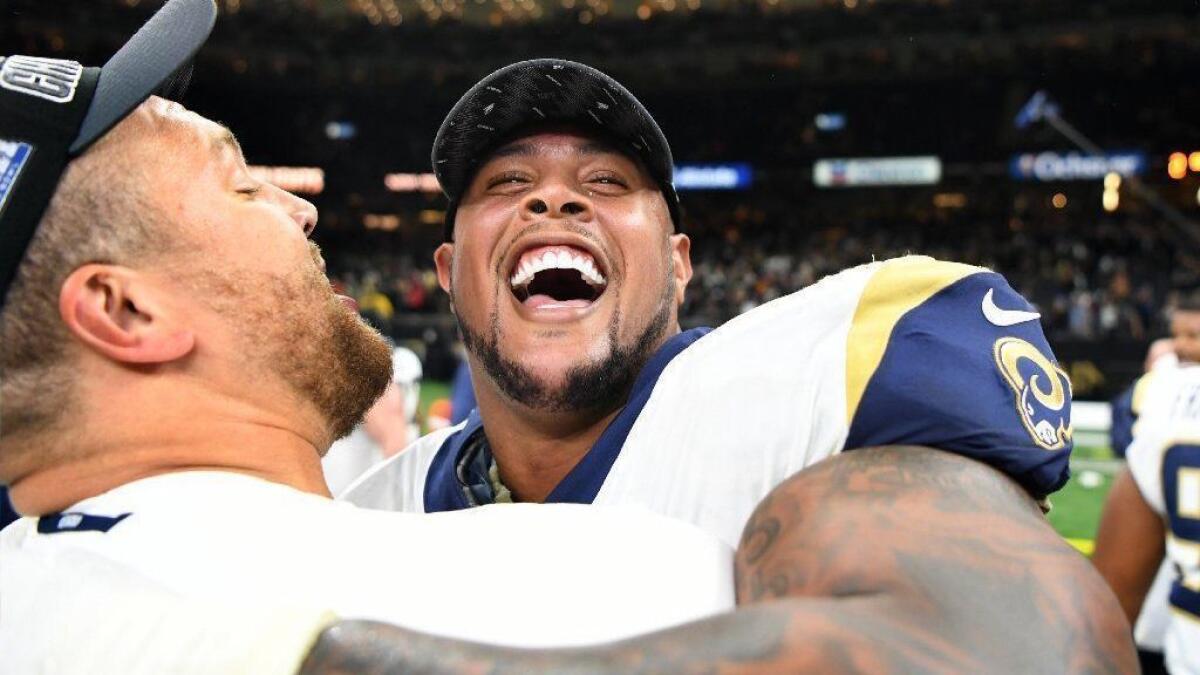 Rodger Saffold, pictured celebrating in January following the Rams' victory in the NFC Championship game, has paid $3.88 million for a newly built Encino home.