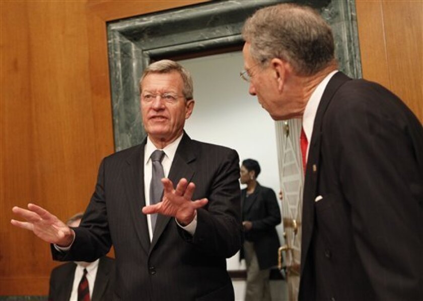Senate Finance Committee Chairman Sen. Max Baucus, D-Mont., left, talks with the committee's ranking Republican Sen. Charles Grassley, R-Iowa, on Capitol Hill in Washington, Tuesday, May 12, 2009, prior to the start of the committee's hearing on overhauling the heath care system. (AP Photo/Pablo Martinez Monsivais)