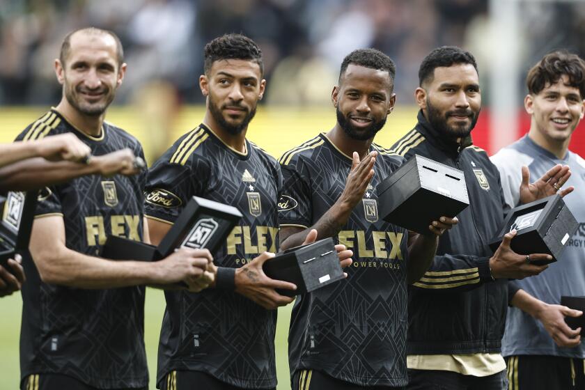 LOS ANGELES, CALIFORNIA - MARCH 04: Los Angeles FC players react as they accept their championship rings.