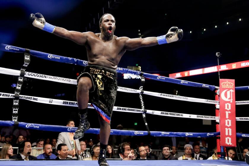 Bermane Stiverne enjoys the moment after winning the WBC heavyweight belt by stopping Chris Arreola in the sixth round Saturday at Galen Center.