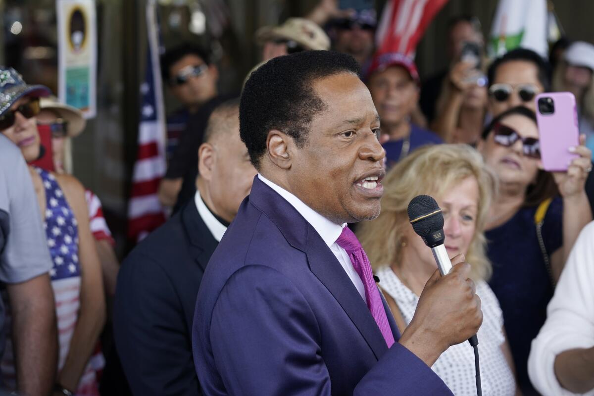 Larry Elder speaks to supporters during a July campaign stop in Norwalk.