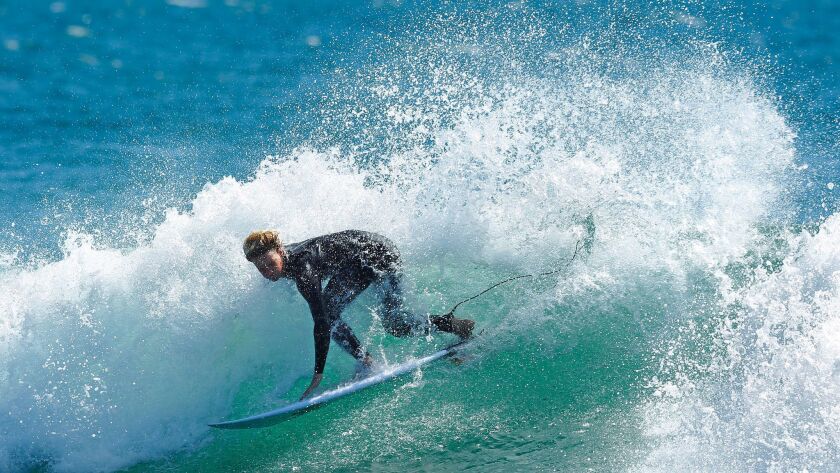 Brock Crouch, 17, of Carlsbad is a member of both the U.S. surfing team and U.S. snowboarding team. Crouch is shown here surfing in Oceanside.