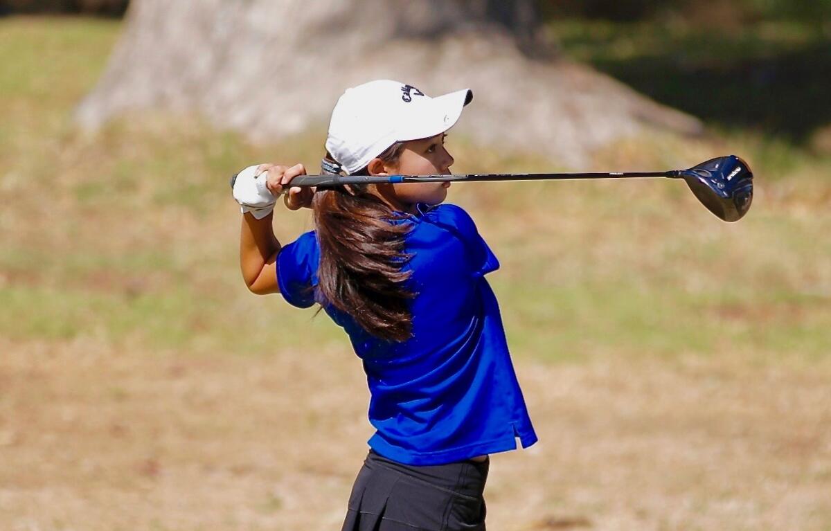 Palisades High's Anna Song follows through on her golf swing.