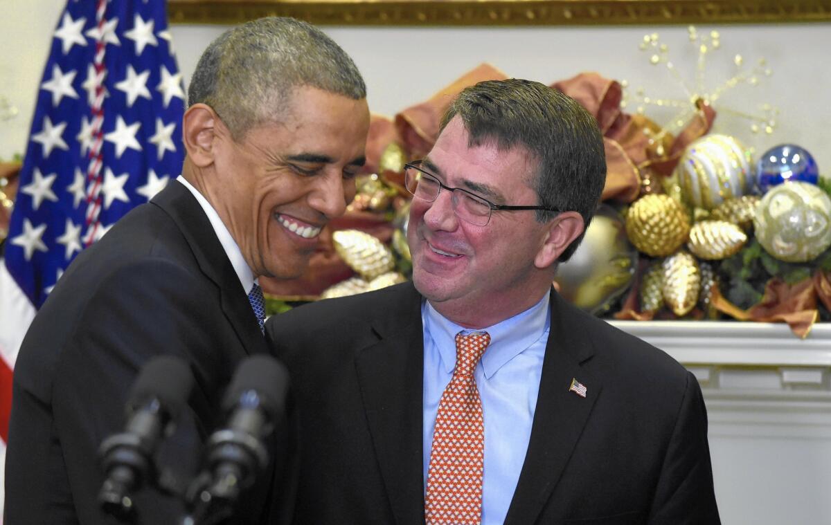 President Barack Obama jokes with Ashton Carter, his nominee for Defense secretary. Obama praised Carter's strategic perspective and technical know-how, his work under 11 previous Pentagon chiefs and his love for Motown music.
