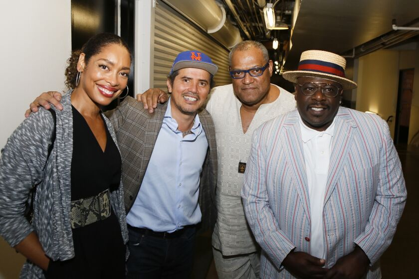 From left, actor Gina Torres, write-performer John Leguizamo, actor Laurence Fishburne and actor Cedric the Entertainer backstage after the opening night performance of “Latin History for Morons” at the Ahmanson Theatre in Los Angeles on Sept. 8, 2019.