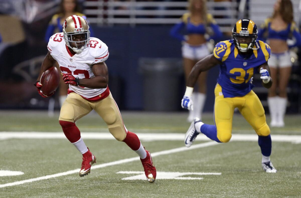San Francisco 49ers running back Reggie Bush carries the ball during a game against the St. Louis Rams on Nov. 1.