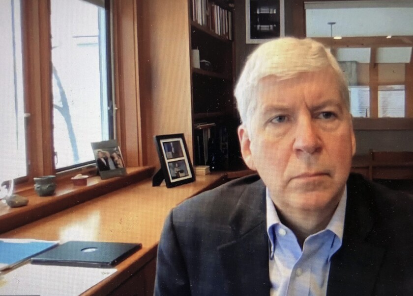 FILE - In this Jan. 18, 2020, screen shot from video, shows former Michigan Gov. Rick Snyder, during his Zoom hearing in the 67th District Court in Flint, Mich. The Michigan Supreme Court heard arguments Wednesday, May 4, 2022 that could wipe out charges against former Gov. Rick Snyder and eight others in the Flint water scandal, as lawyers challenged a rarely used, century-old method to investigate crimes and file indictments. (67th District Court in Flint via AP, file)