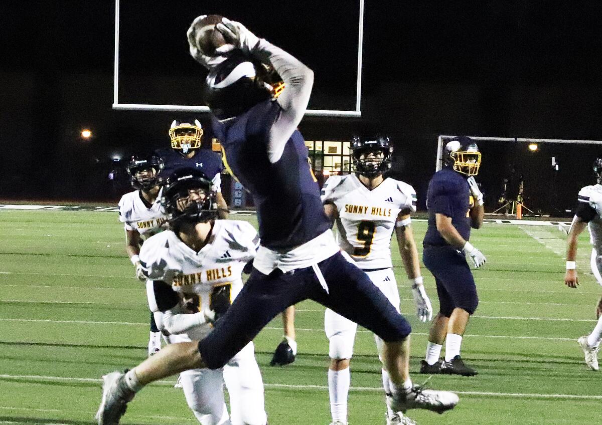Marina's Ty Green makes a leaping catch for a touchdown in the fourth quarter against Sunny Hills on Friday at Boswell Field.