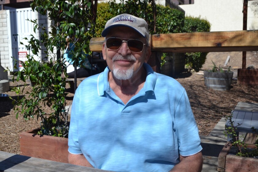 John Wismont sits at a Poway coffee shop recently. He is making a documentary on Father Joe Carroll.