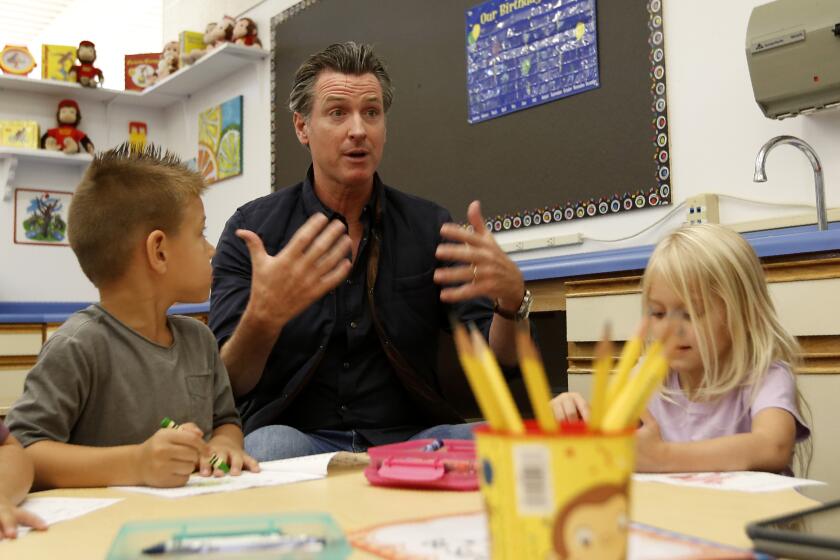 Gov. Gavin Newsom visits a group of kindergartners during his visit to the Paradise Ridge Elementary School in Paradise, Calif., Wednesday, Aug. 21, 2019. Newsom toured the school and visited with students and teachers that just returned to school last week from the summer break in the community that was ravaged by last year's Camp Fire. New California data shows insurance companies declined to renew nearly 350,000 home insurance policies in areas at high risk for wildfire since the state began collecting data in 2015. (AP Photo/Rich Pedroncelli, Pool)