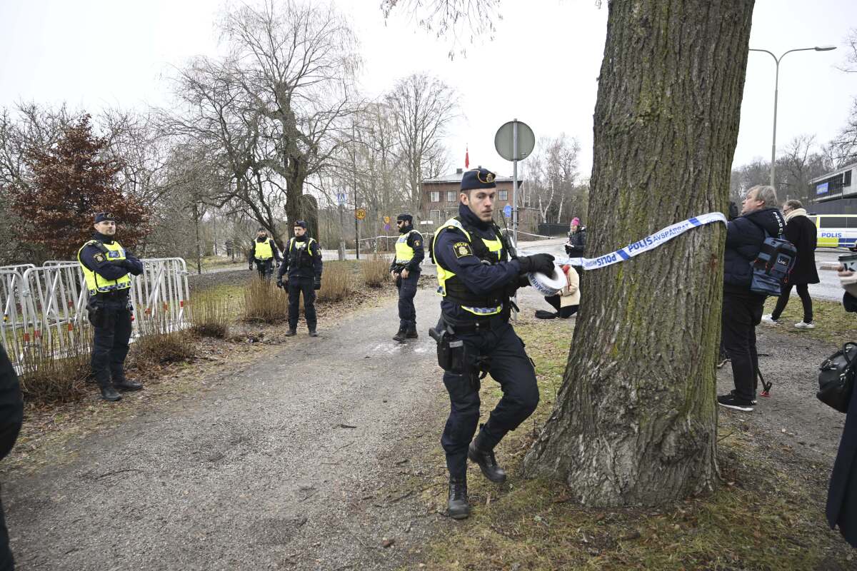 FILE - Police cordon off the area outside the Turkish embassy in Stockholm, Sweden, on Jan. 21, 2023. The Swedish domestic security agency warned Wednesday Feb. 8, 2023 that the threats of attacks in the Scandinavian country have increased in recent weeks following the burning of the Quran outside the Turkish Embassy in the capital.(Fredrik Sandberg/TT News Agency via AP, File)